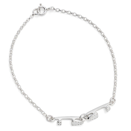 silver bracelet with two tiny interlinked silver ice skating blades