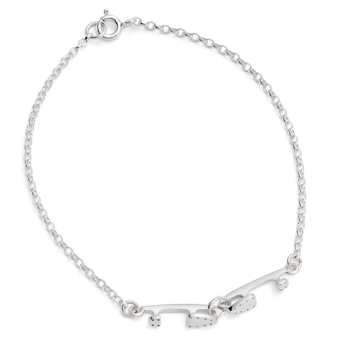 silver bracelet with two tiny interlinked silver ice skating blades