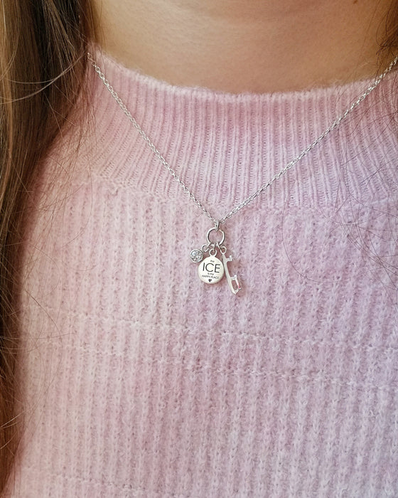 girl in a pink jumper wearing a silver happy place ice charms necklace