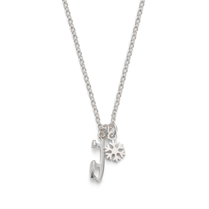 silver snowflake and ice skate blade charm necklace on a white background