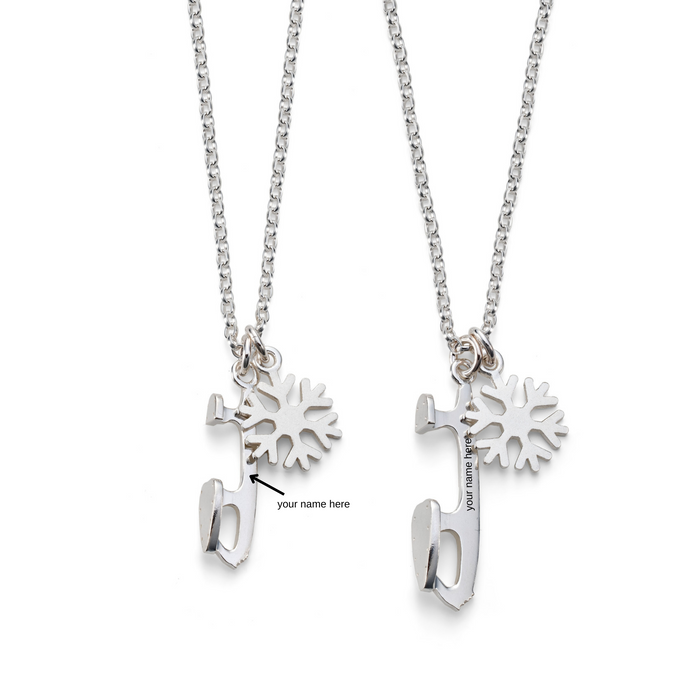 Two silver necklaces with snowflake charms and ice skate blade pendants, one small and one medium in size, displayed against a white background.