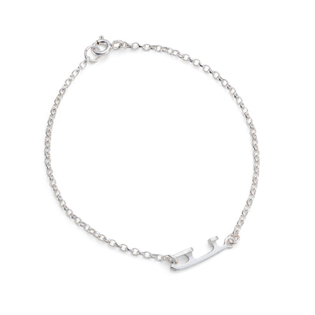 silver ice skating bracelet featuring a tiny ice skate blade on a white background