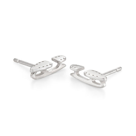 tiny silver ice skate blade stud earrings on a white background