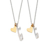 Two ice skating necklaces, one with a small silver skate blade charm and a gold-plated heart, the other with a medium silver skate blade charm and a gold-plated heart, displayed on white backgrounds.