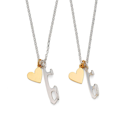 Two ice skating necklaces, one with a small silver skate blade charm and a gold-plated heart, the other with a medium silver skate blade charm and a gold-plated heart, displayed on white backgrounds.