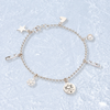 Silver Ice Skating Charms Bracelet on an icy background