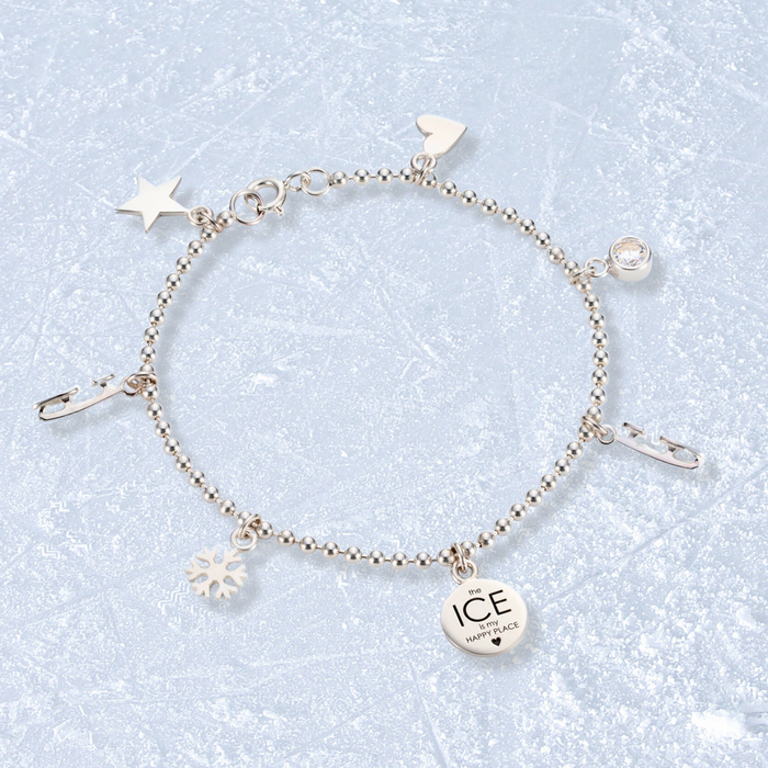 Silver Ice Skating Charms Bracelet on an icy background