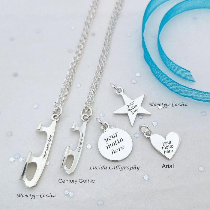 Silver necklaces with customizable ice skate blade pendants on a light gray background