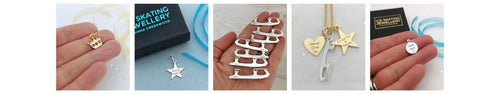 Collection of various silver necklaces on a plain background