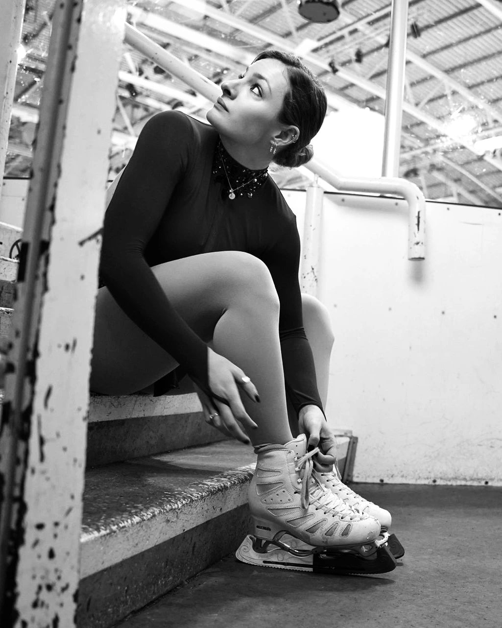 Lacing skates before first session of the day on ice