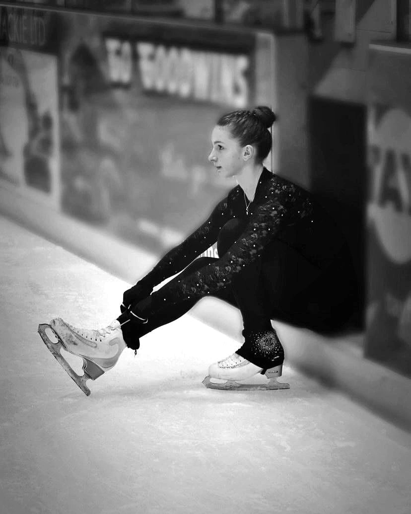 Lacing ice skates before first session of the day