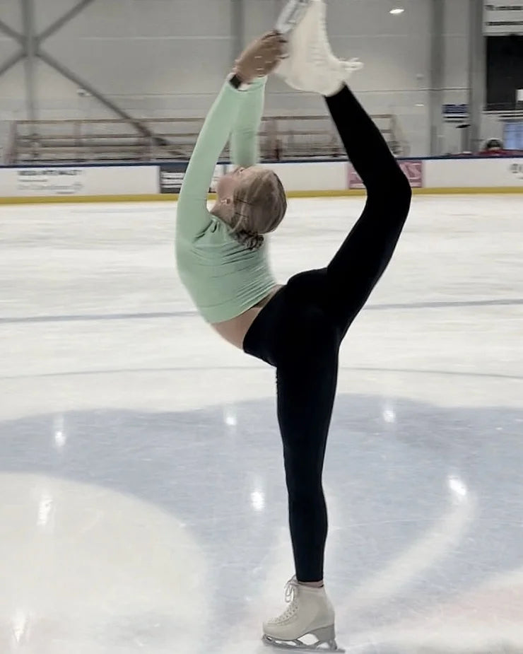 figure skater practising a beilmann spin during a training session