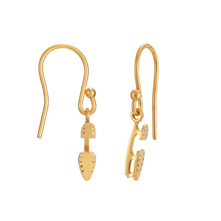 gold ice skate blade hook earrings on a white background