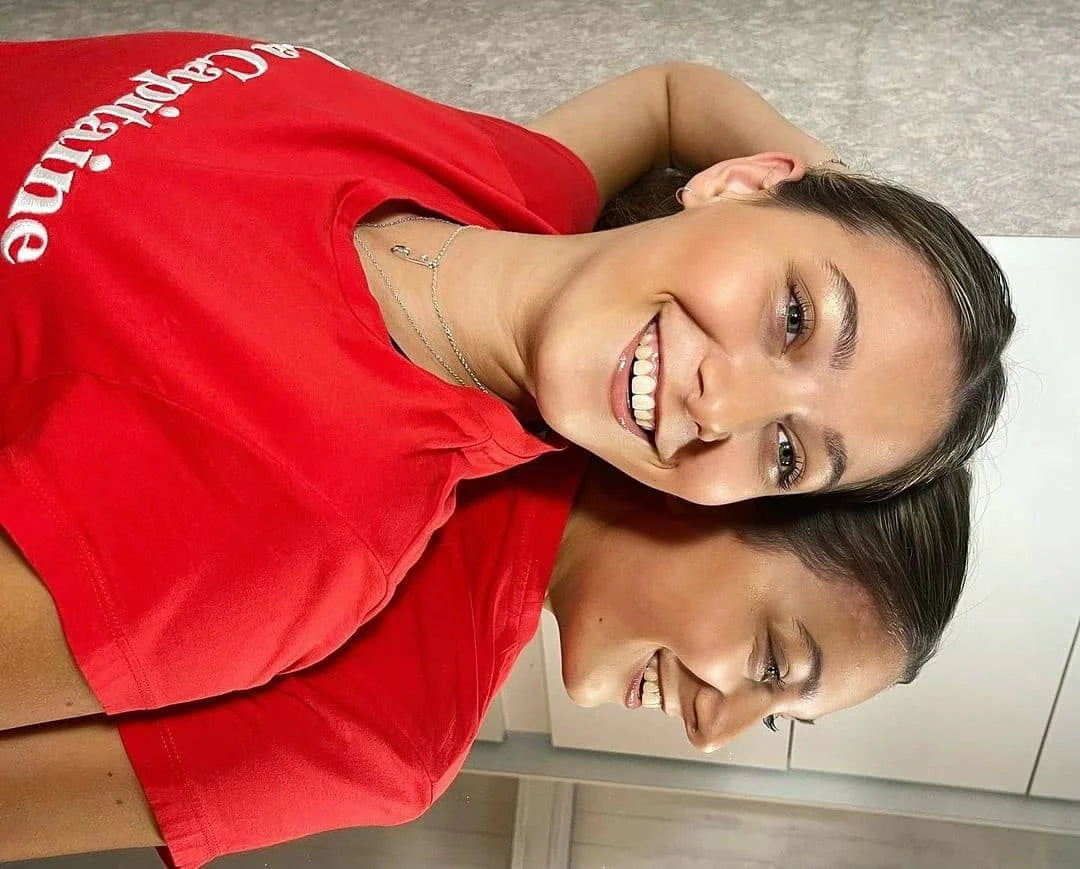 figure skater isabella smit wearing a red top and a personalised silver ice skating  necklace