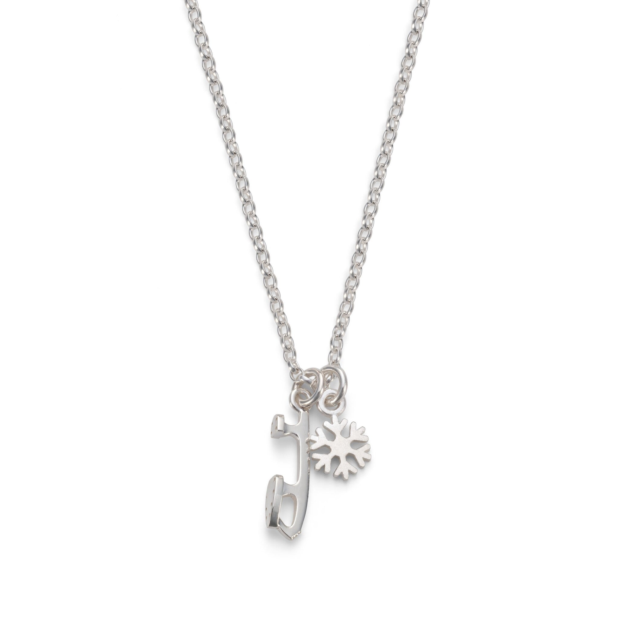 silver snowflake and ice skate blade charm necklace on a white background