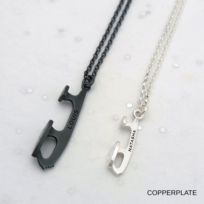 Two personalized necklaces with engraved names on a light gray background.