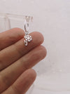 silver ice skate blade and snowflake hoop earring moving