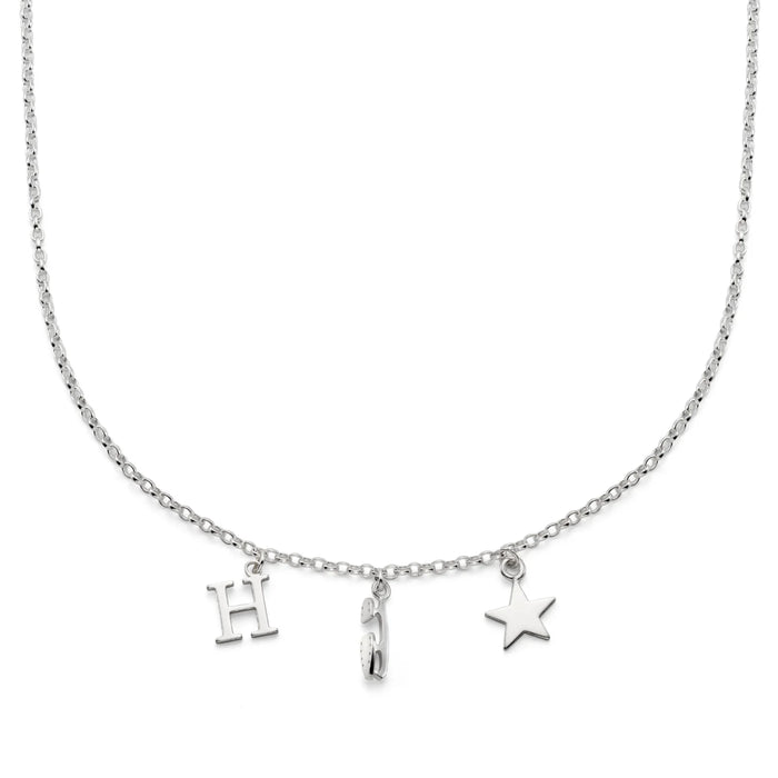 Silver necklace with 'H', ice skate blade, and star charms on a white background