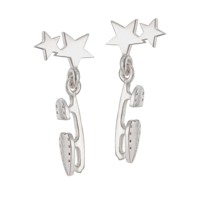 silver skate blade and star stud earrings on a white background