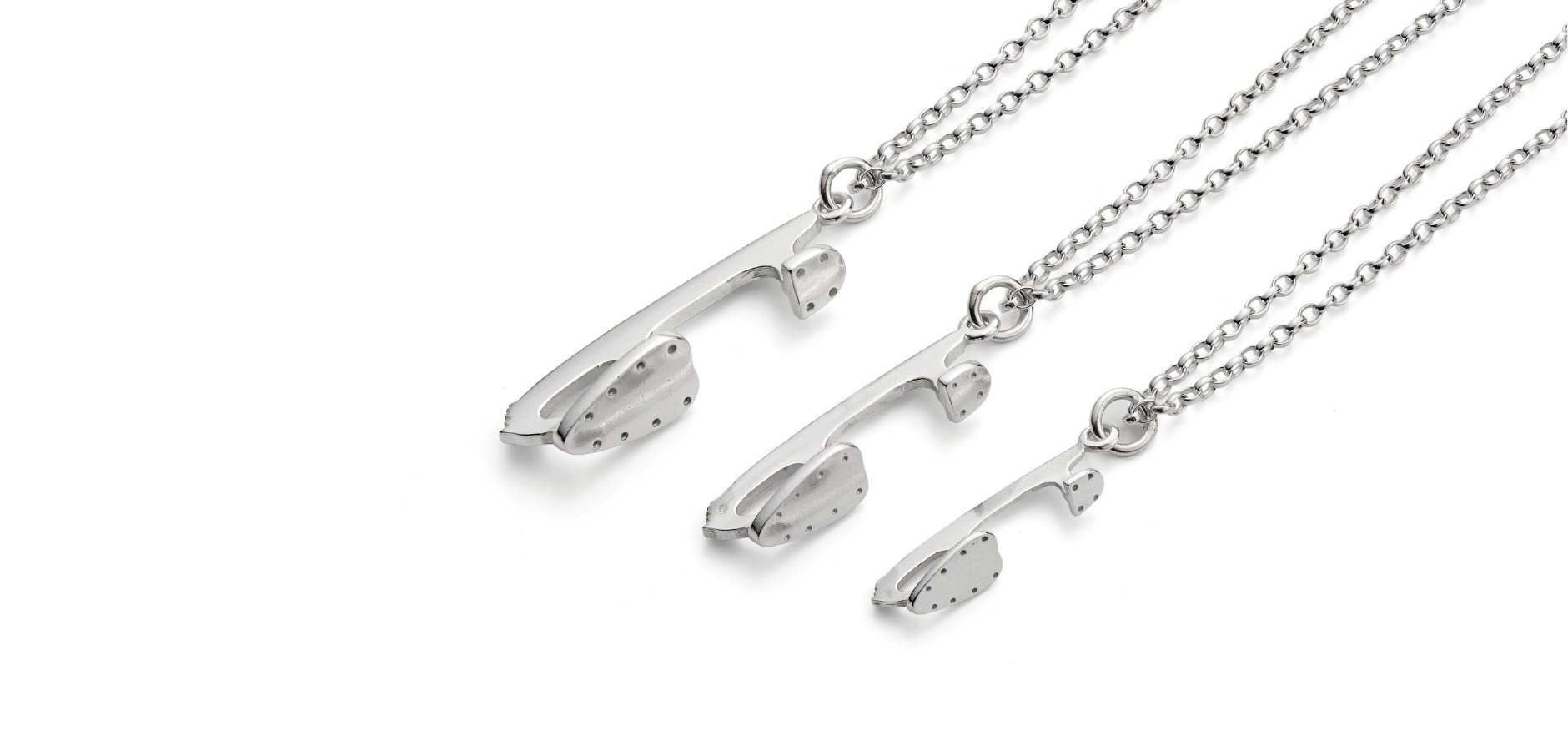 Silver Ice Skating Jewellery Necklaces on a white background