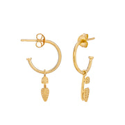 gold ice skating stud hoop earrings on a hand showing the detail