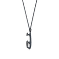 An oxidised sterling silver ice skate pendant on a matching oxidised sterling silver chain.
